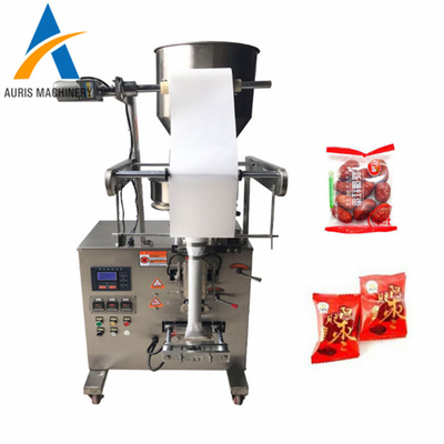 Grânulo automático que pesa os feijões da máquina de embalagem do chocolate que selam a máquina